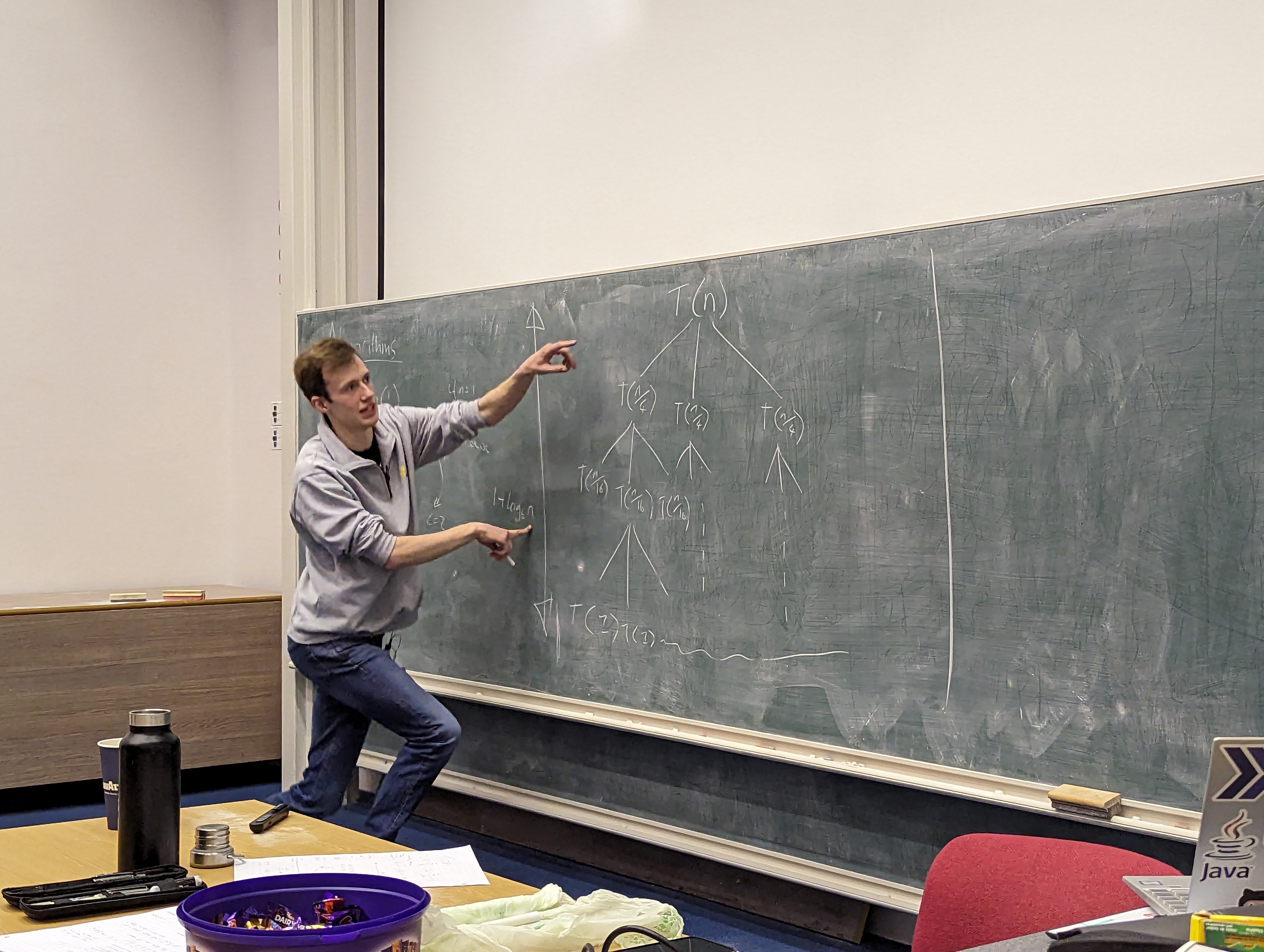 A photo of me explaining the Master Theorem using a blackboard.